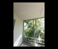 Monter suszarek sufitowych do suszenia ubrań. - 7/16