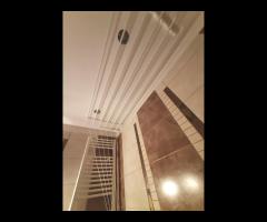 Monter suszarek sufitowych do suszenia ubrań. - 14/16